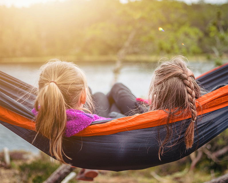 Photo with two young girls in a hammock