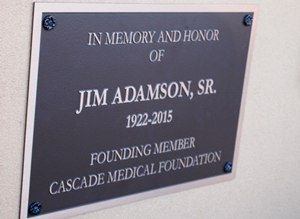 A close up of the plaque dedicated to the late Jim Adamson.
