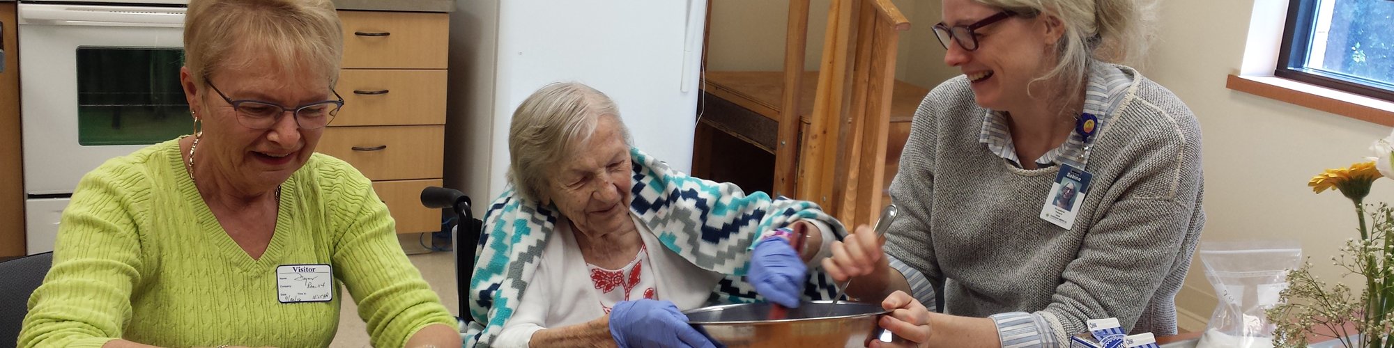 Occupational Therapist Sabine Kaul-Connolly helps a patient with a baking project.