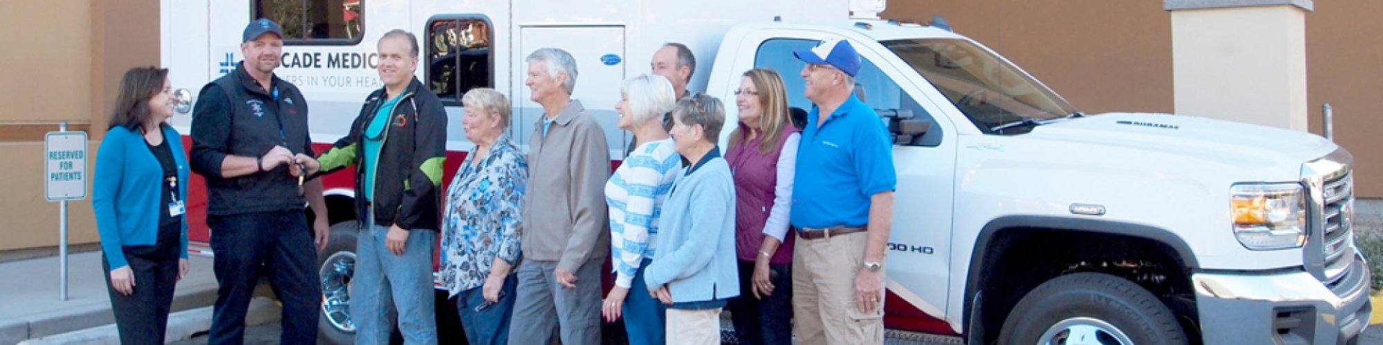 Members of the Cascade Medical Foundation present the keys to a new ambulance to Ambulance Director Brian Pulse and Cascade Medical CEO Diane Blake.