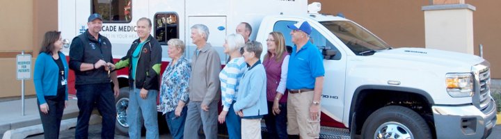 Members of the Cascade Medical Foundation present the keys to a new ambulance to Ambulance Director Brian Pulse and Cascade Medical CEO Diane Blake.